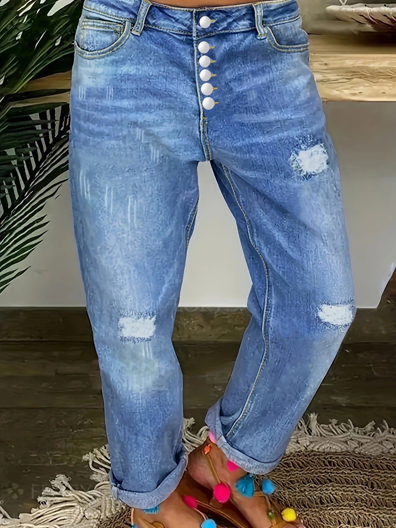 Plus-size women's high-waisted stretch jeans with multiple buttons, distressed jeans, street style