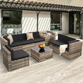 8-piece Outdoor Rattan Patio Furniture Segmented Set, Glass-topped Table with Hidden Storage, Grey Rattan with Blue Padded Mats